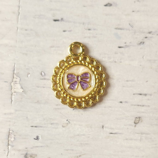 Pretty mauve bow heart charm