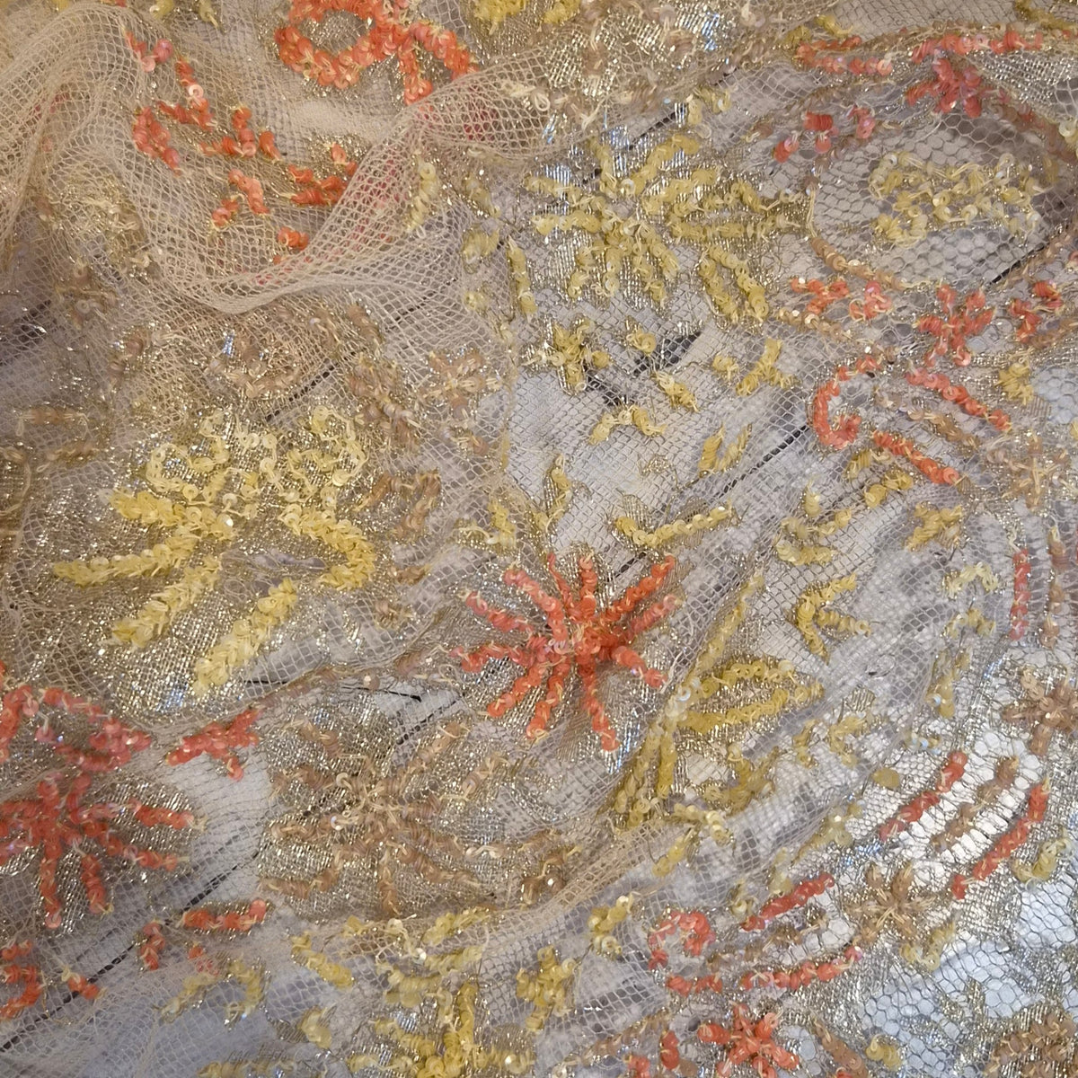 Orange and gold sequined lace