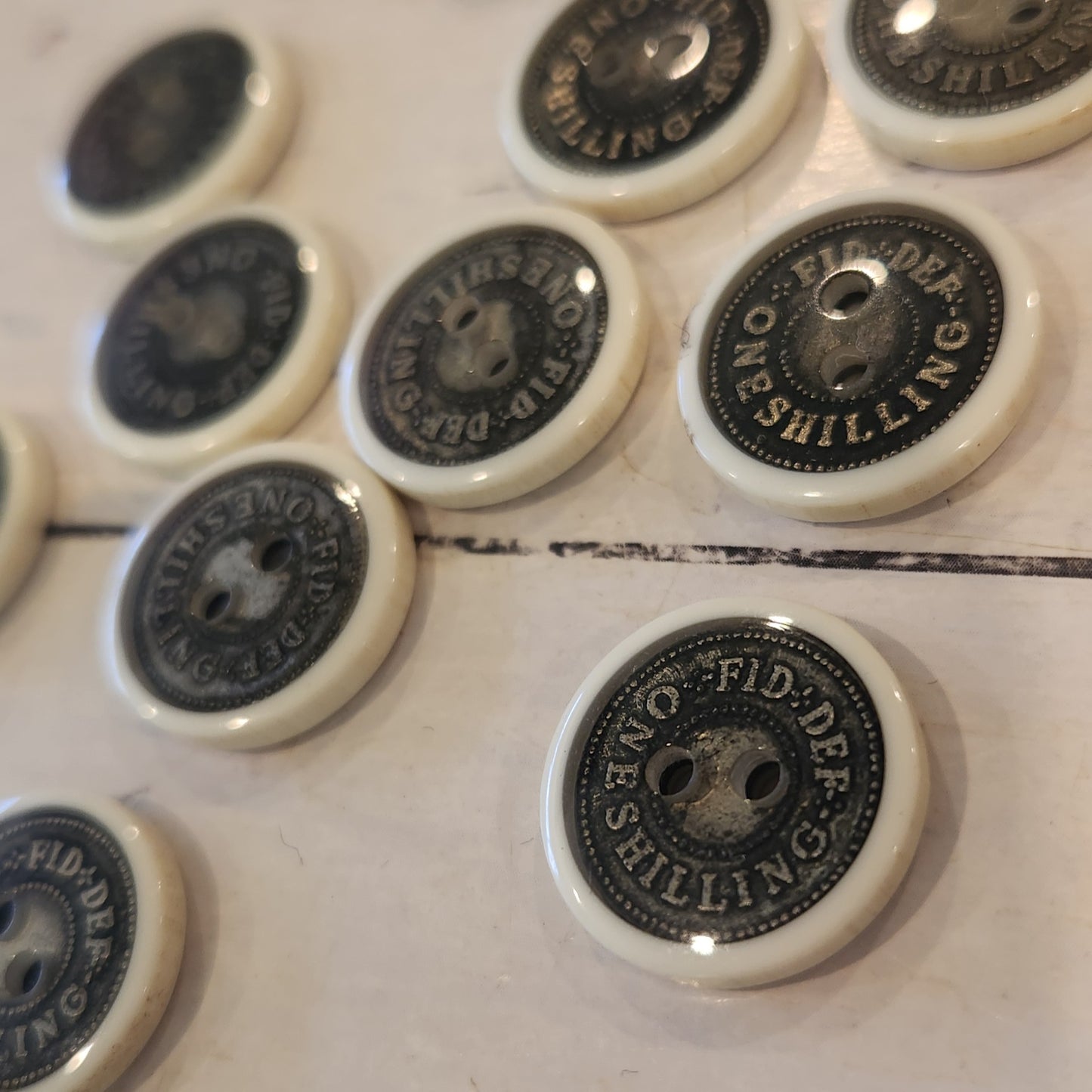 One schilling 17mm button