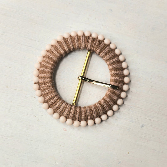 Fine cord and bead buckle