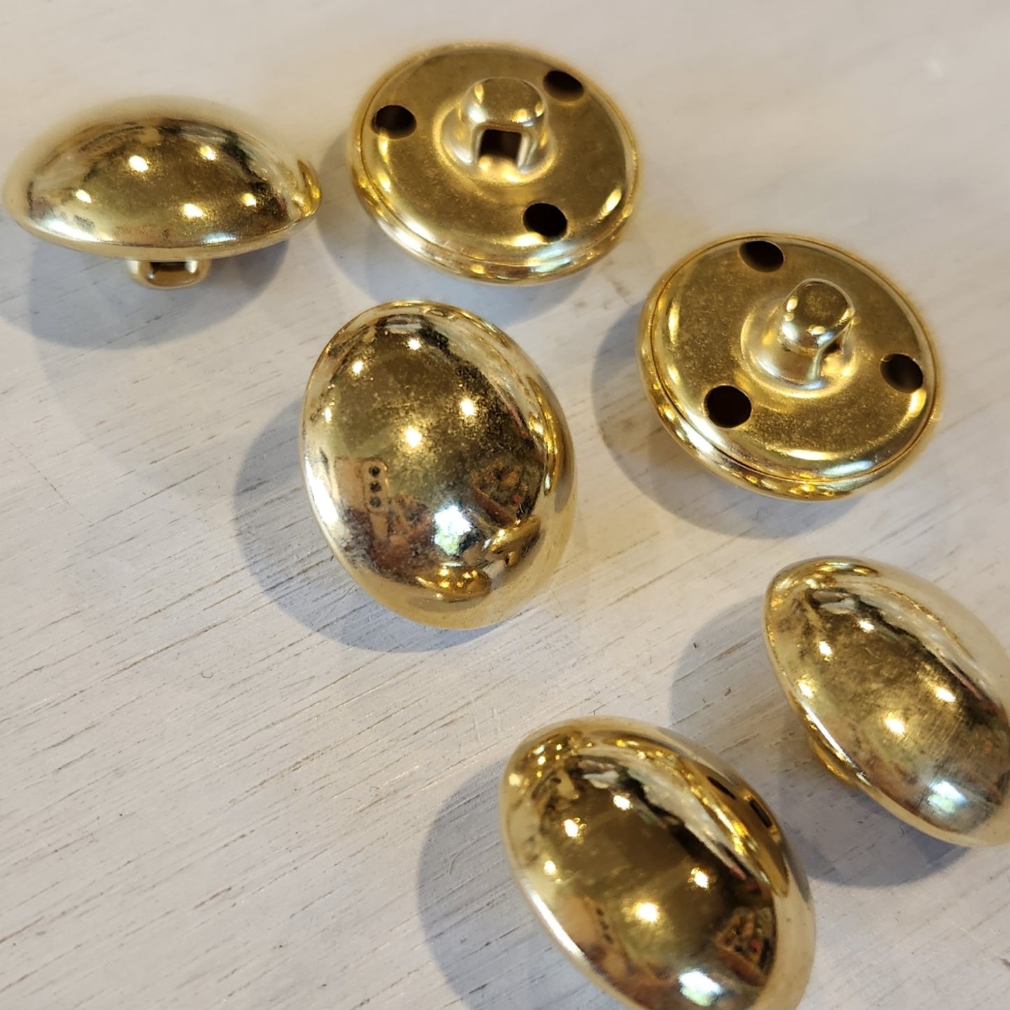 Shinny dome gold button