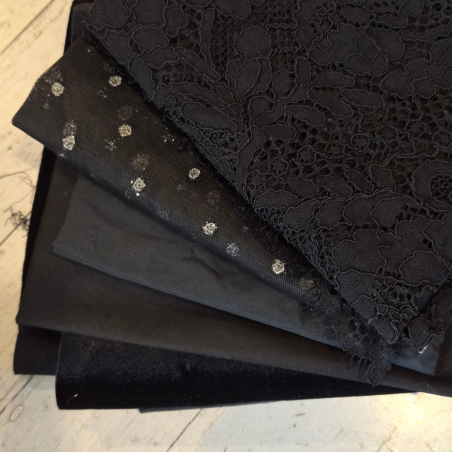 155. 4 pieces corded lace, sequin tulle, cotton sateen and stretch velvet