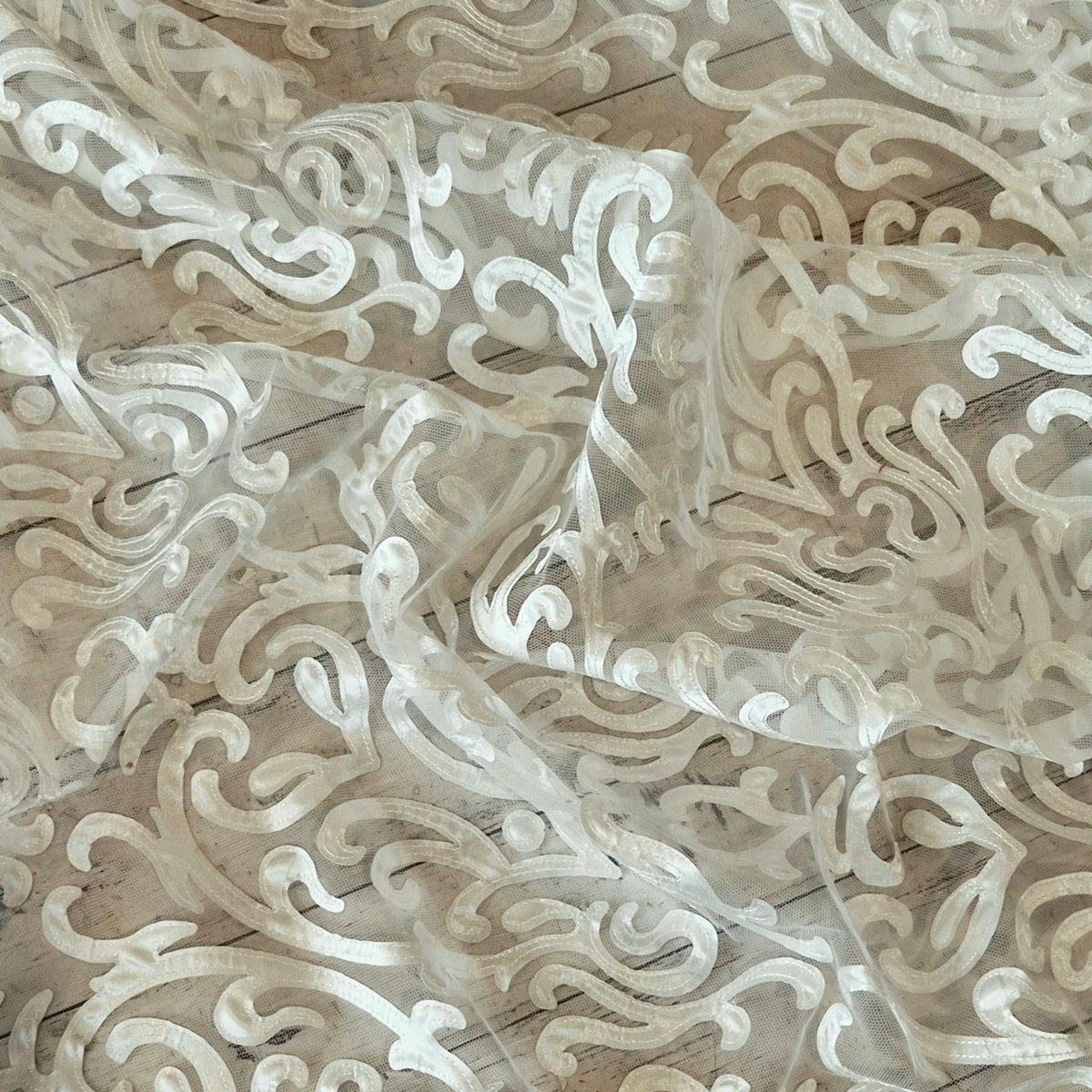 Ivory patterns stitched ribbon mesh
