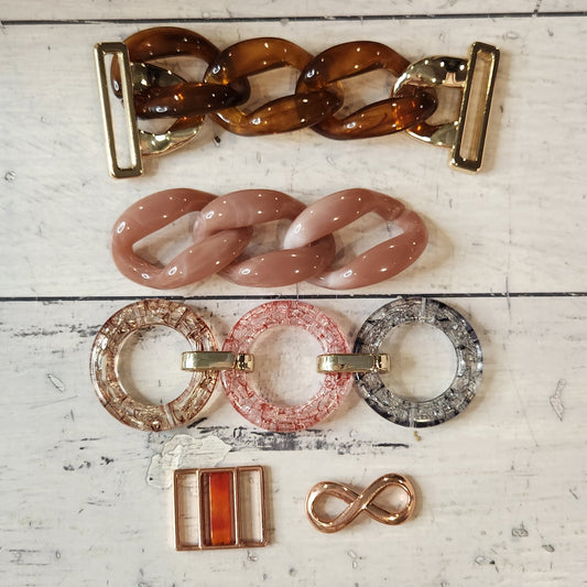 22. Collection of metal and plastic embellishments