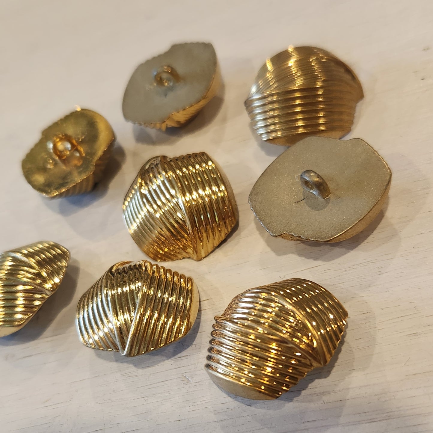 Armour gold button