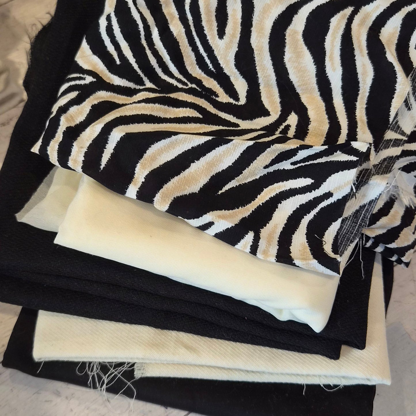 152. 5 pieces assorted fabrics viscose, wool and fusible interfacing