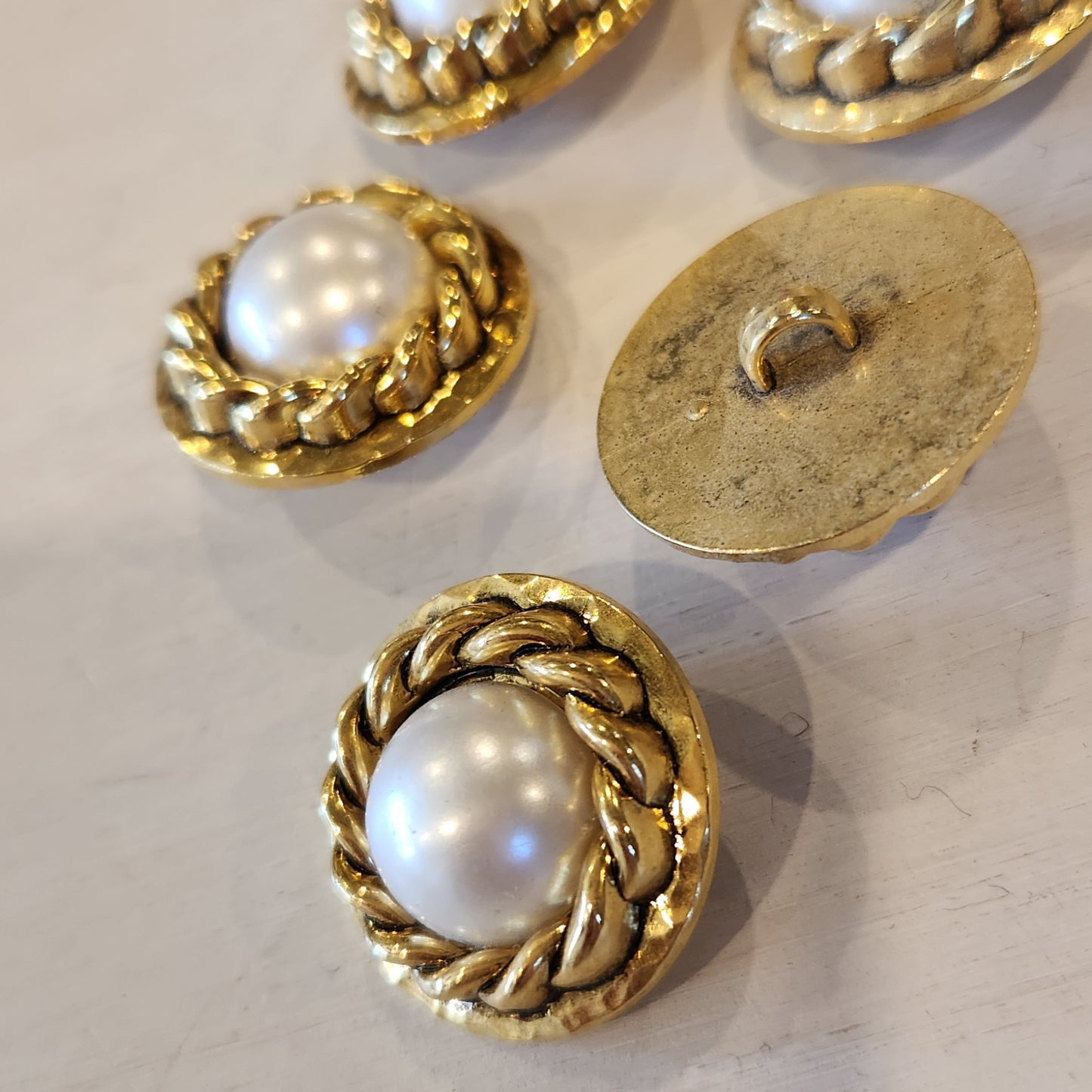 Rope and pearl gold button